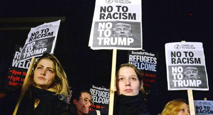 Anti-racism and anti-Trump supporters protest outside the US embassy in London