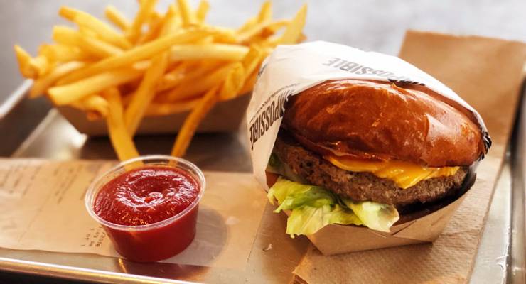 An Impossible Burger with fries.