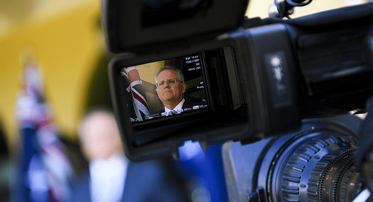Scott Morrison is seen through a TV camera viewfinder (Image: AAP/Lukas Coch)