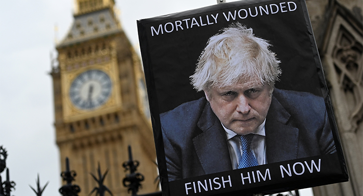 An anti-Boris Johnson placard outside Parliament in London (Image: AAP/EPA/Andy Rain)