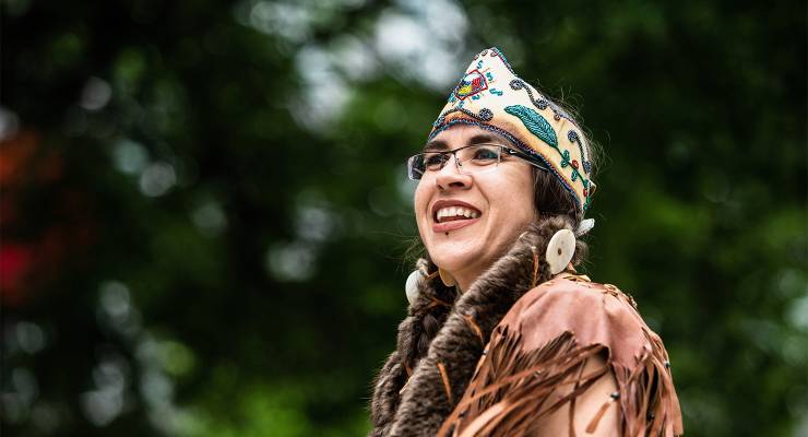 An Indigenous dancer in full traditional dress on National Indigenous Peoples Day in Montreal, Canada (Image: AAP/Giordanno Brumas/SOPA Images/Sipa USA)
