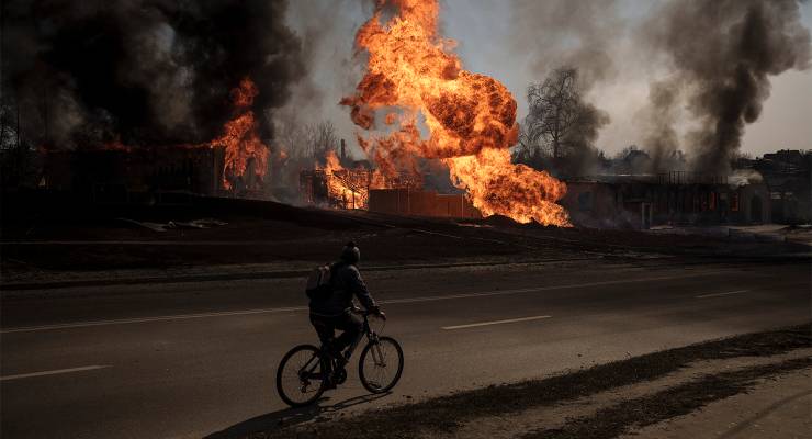A man near a fire following a Russian attack in Kharkiv, Ukraine (Image: AAP/AP/Felipe Dana)