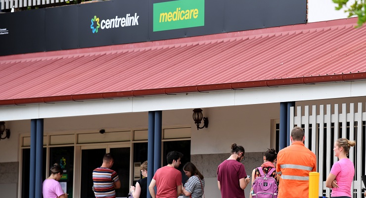 People outside a Brisbane Centrelink office (Image: AAP/Dan Peled)