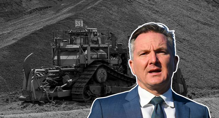 Energy Minister Chris Bowen and a pile of coal in the Hunter Valley (Image: AAP/AP/Mark Baker)
