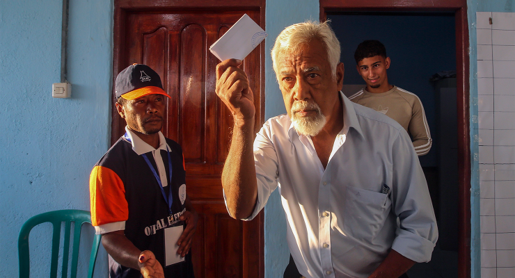 Xanana Gusmão holds his ballot paper as he casts his vote in Dili, Timor-Leste (Image: AAP/Antonio Dasiparu)