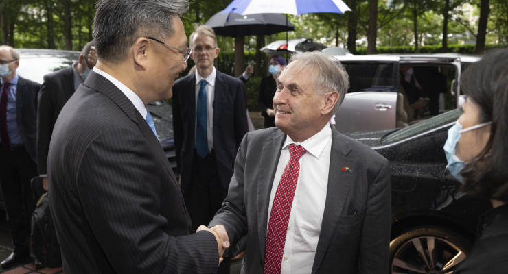 Trade Minister Don Farrell is greeted by his Chinese counterpart Wang Wentao in Beijing