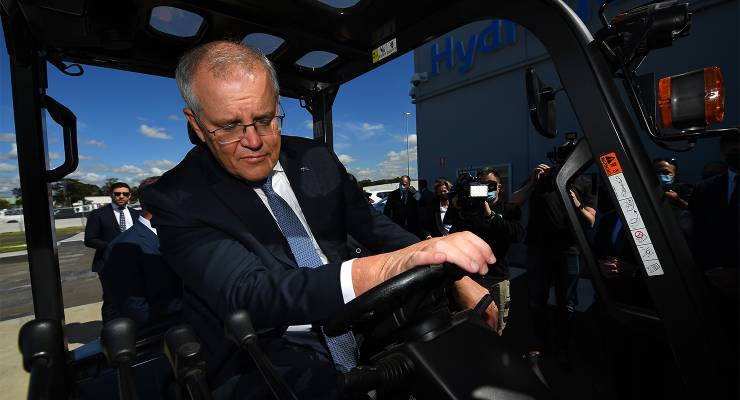 Former prime minister Scott Morrison driving a forklift (Image: AAP/James Ross)