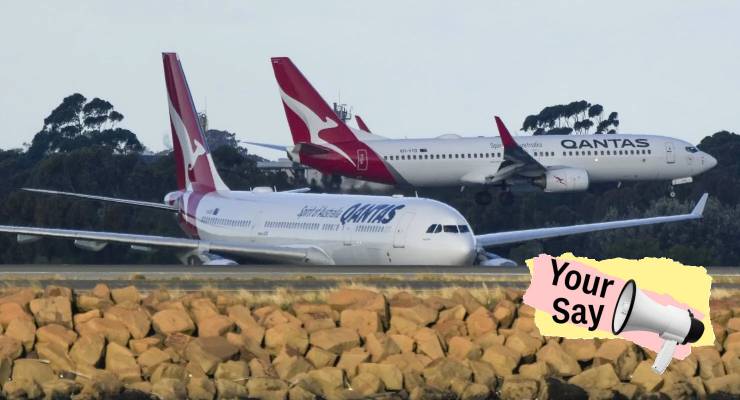 Qantas jets cross at Sydney Airport (Image: AP/Mark Baker)