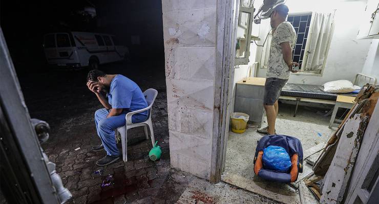 A doctor at the scene of Al-Ahli hospital after an air-strike in Gaza City (Image: EPA/Mohammed Saber)