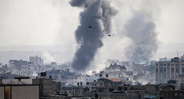 Smoke billows from the Tel al-Hawa neighborhood in Gaza after Israeli air strikes (Image: AAP/EPA/Mohammed Sabed)