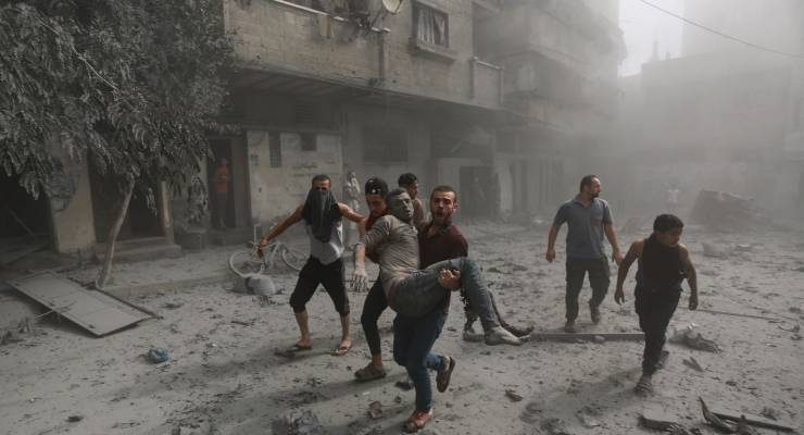 PALESTINIANS EVACUATE A WOUNDED MAN FOLLOWING ISRAELI AIRSTRIKES (IMAGE: AP/ABED KHALED)