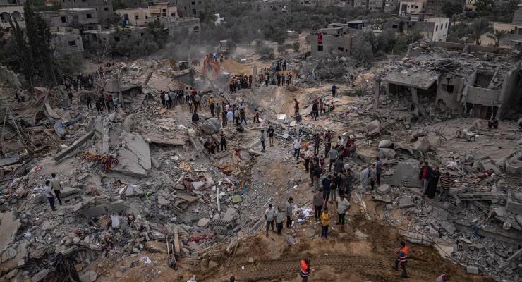 Palestinians look for survivors following an Israeli airstrike