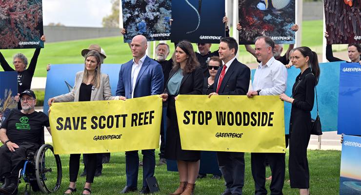 Independent Senator David Pocock and campaigners during a protest against Woodside’s proposed Burrup Hub gas project outside Parliament House (Image: AAP/Mick Tsikas)