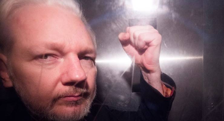 Julian Assange in a prison van in 2019 (Image: EPA/Neil Hall)