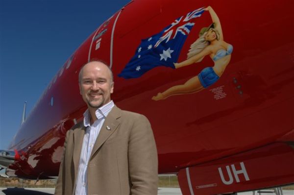 Brett Godfrey and one of his iconic maidens, photo by Virgin Blue