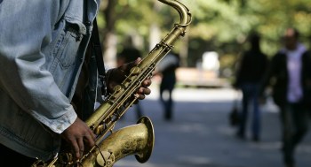 Man plays a saxophone in New York (Image: Reuters/Shannon Stapleton)